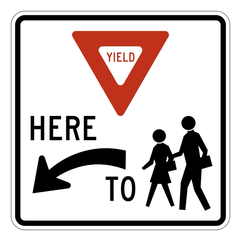 Yield Here to Pedestrian Sign road sign — Sign showing yield triangle, HERE TO text, arrow, and pedestrian